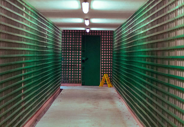 A long hallway featuring alternating green and white stripes along the walls, showcasing storage units in Hernando County, FL.