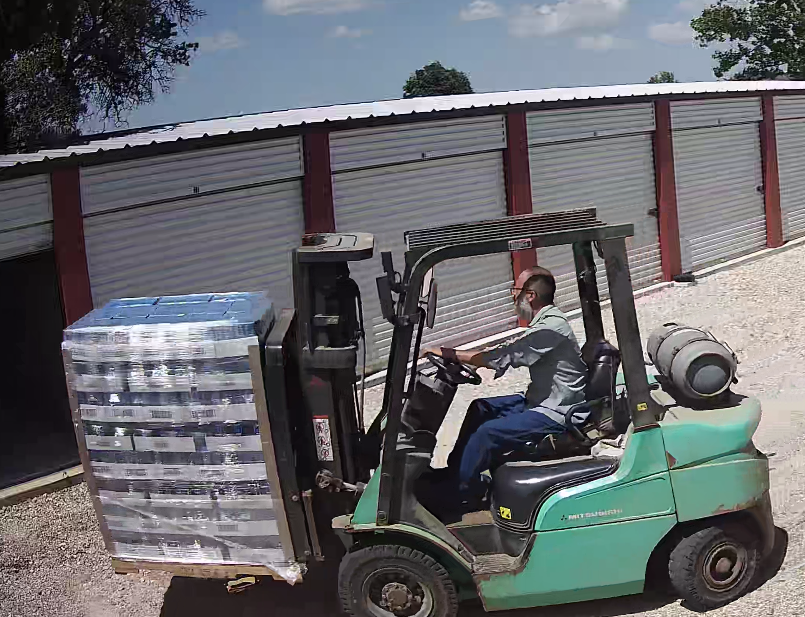 Unloading flood relief supplies at River Hills Storage in Fredericksburg