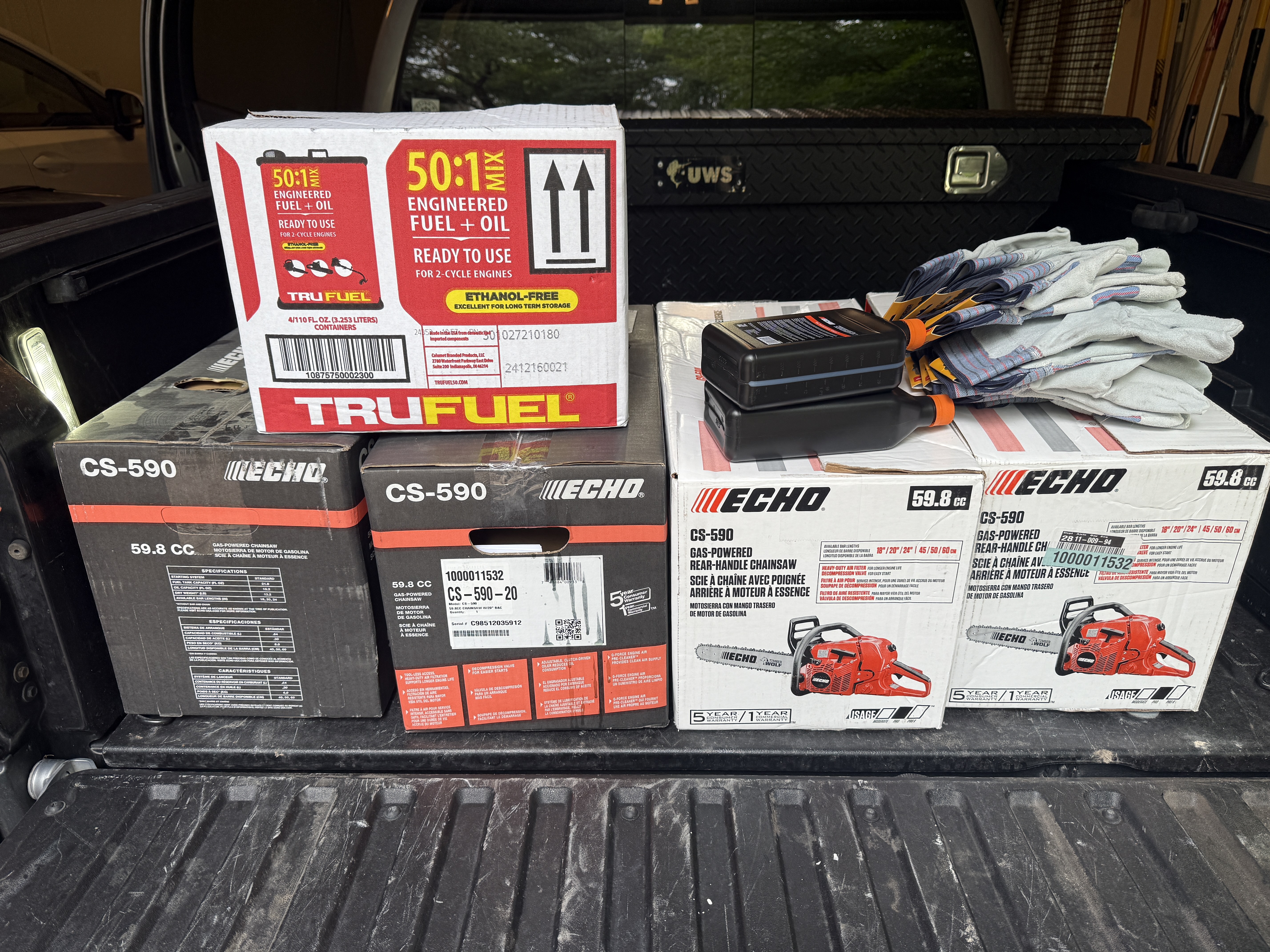 Donation of chainsaws, fuel and work gloves from River Hills Storage