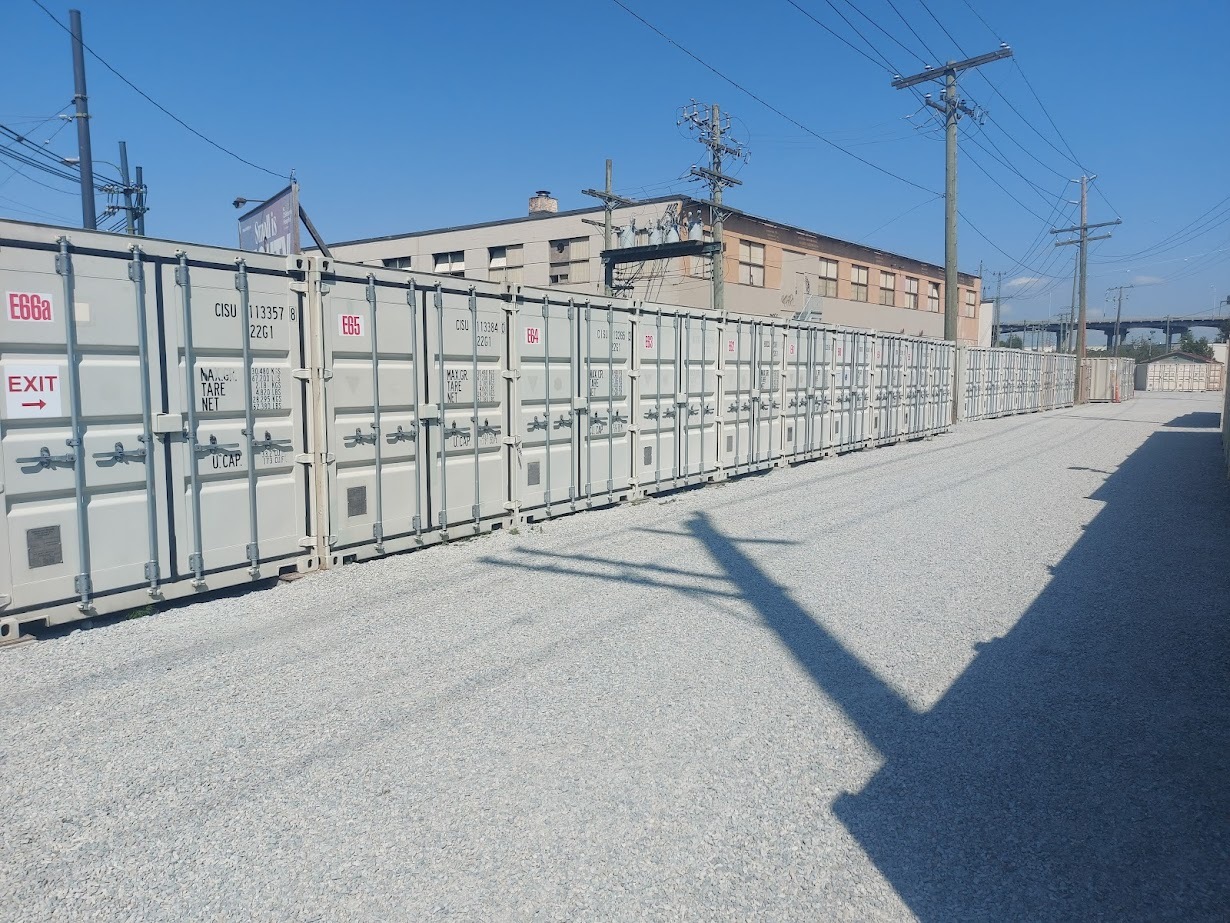 Container units beside gravel lot
