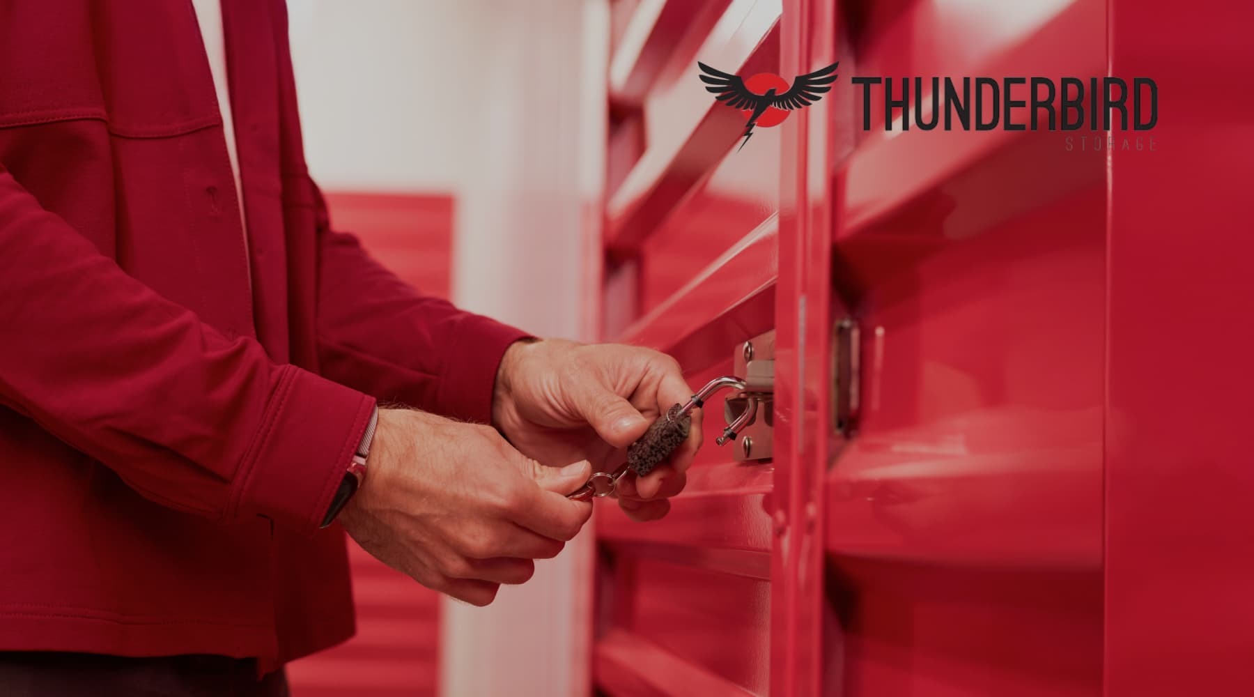 A man locking Thunderbird Storage Box to protect his belongings during remodeling projects A man locking Thunderbird Storage Box to protect his belongings during remodeling projects