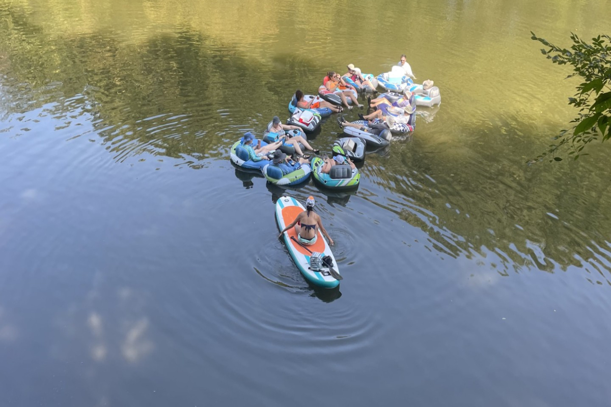 Friends tubing down the Nolichucky River in East Tennessee on a sunny summer day