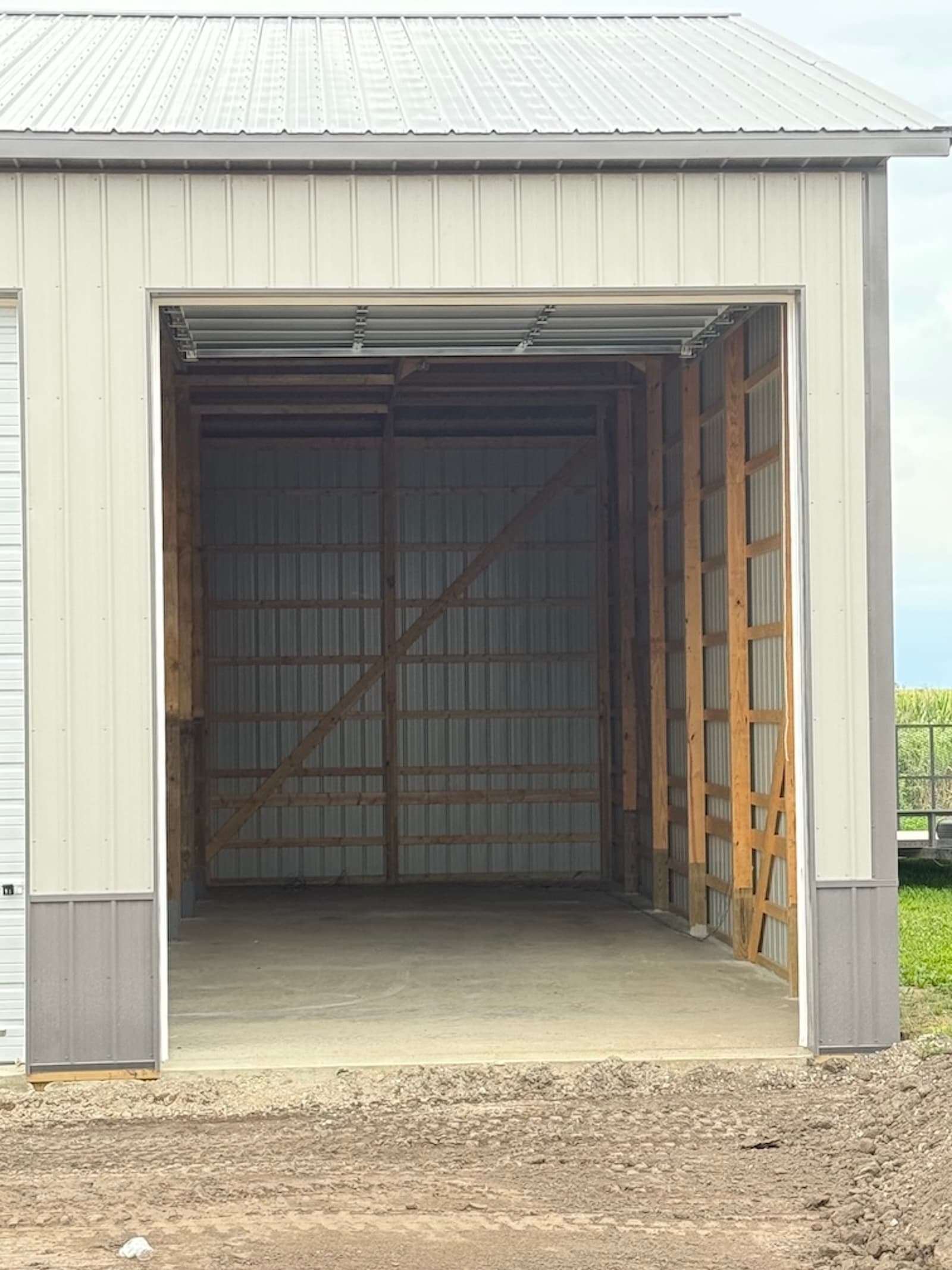 Interior of an empty 48-foot indoor boat and RV storage unit at Route 54 Boat & RV Storage with concrete floor and roll-up door