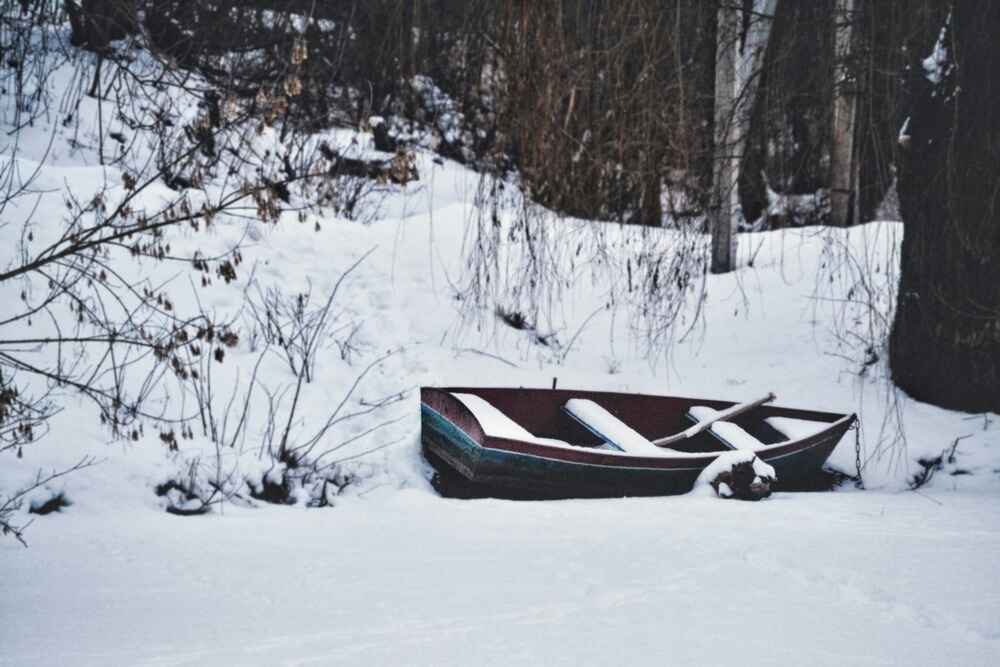 A small boat covered in snow in Williamsburg A small boat covered in snow in Williamsburg