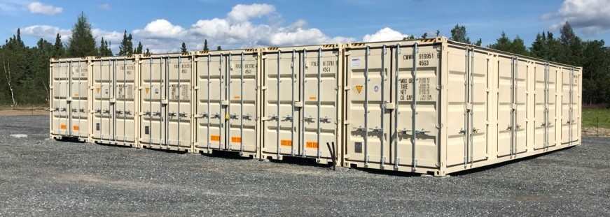 Row of secure steel self-storage containers with convenient drive-up access at DAM Reliable Storage in Kenora.