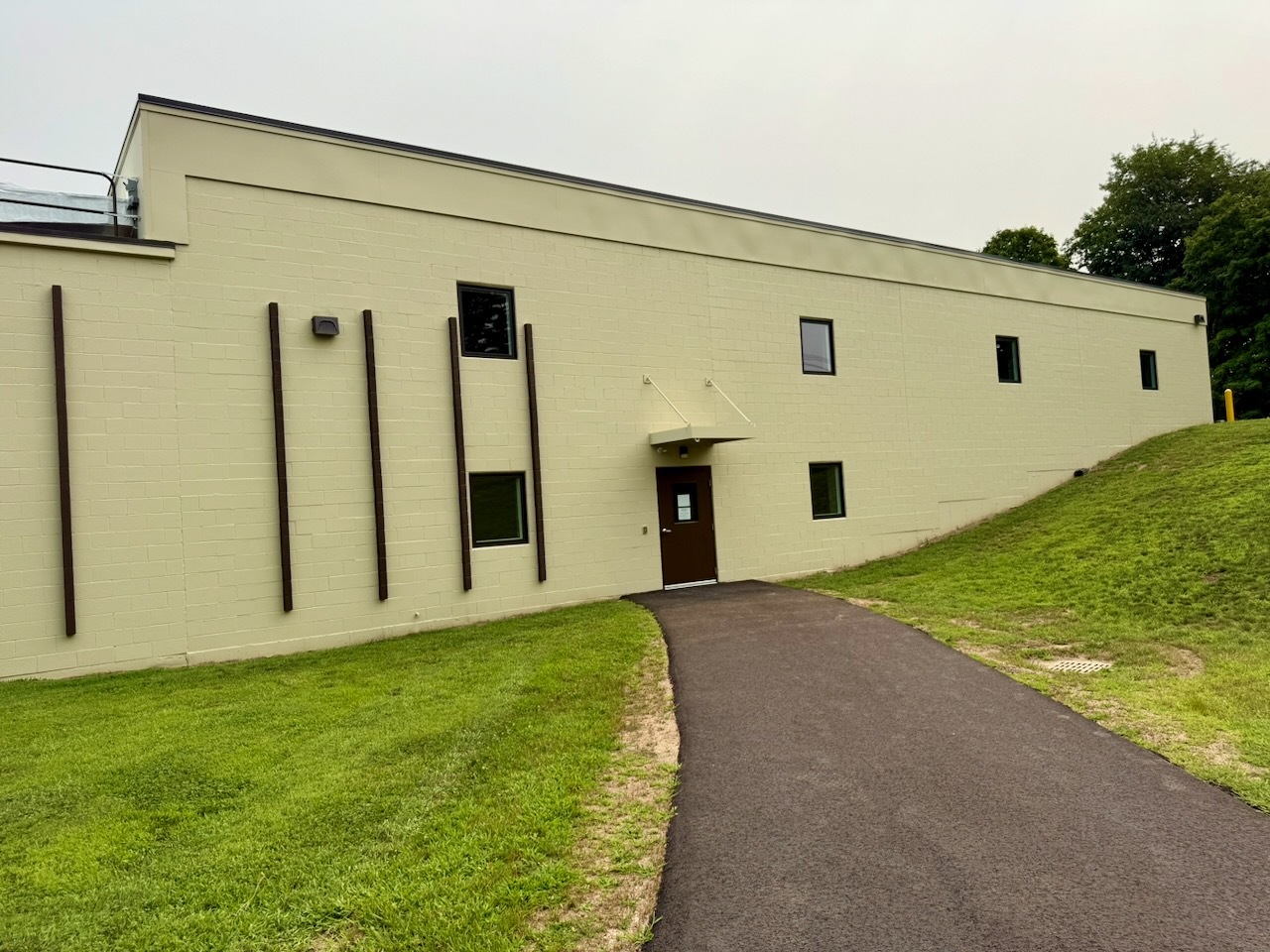 The long climate-controlled building at Southbury Self Storage seen from the road
