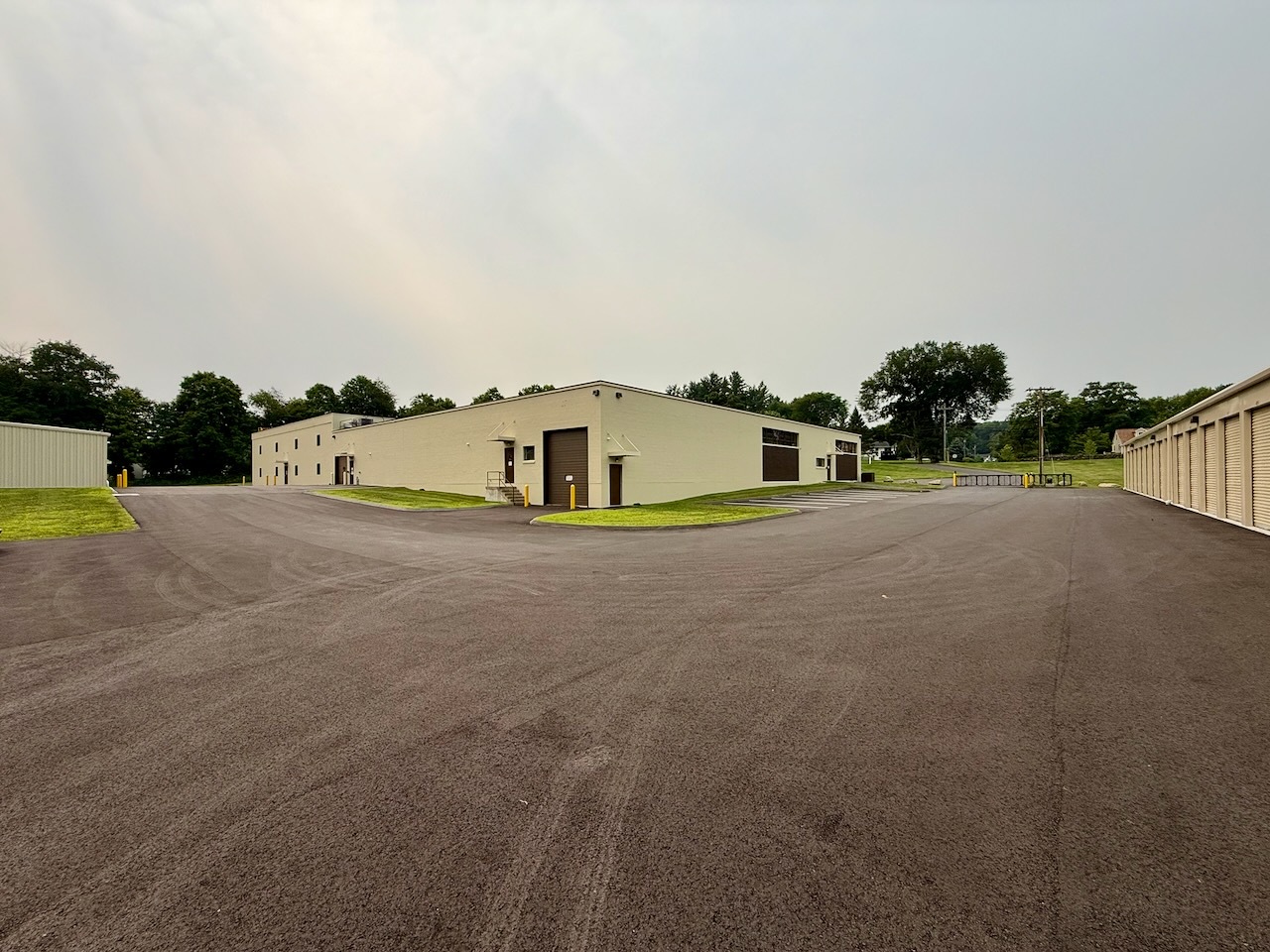 The wide rear drive and parking area at Southbury Self Storage with space for moving trucks and trailers to turn around