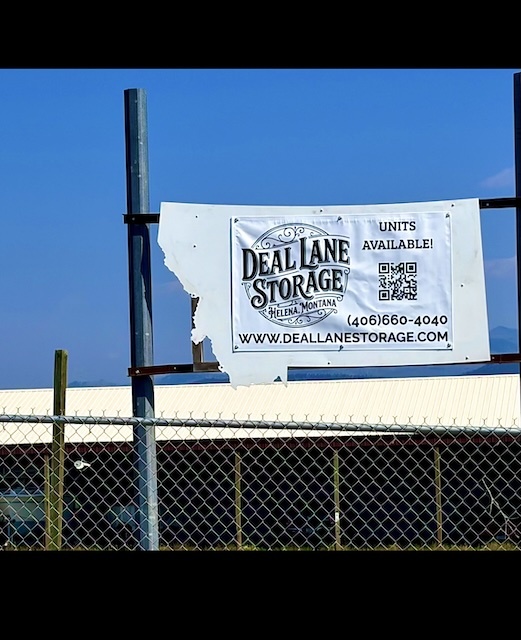 Deal Lane Storage's new Montana-shaped sign mounted above the fence at the facility in Helena, Montana. Deal Lane Storage's new Montana-shaped sign mounted above the fence at the facility in Helena, Montana.