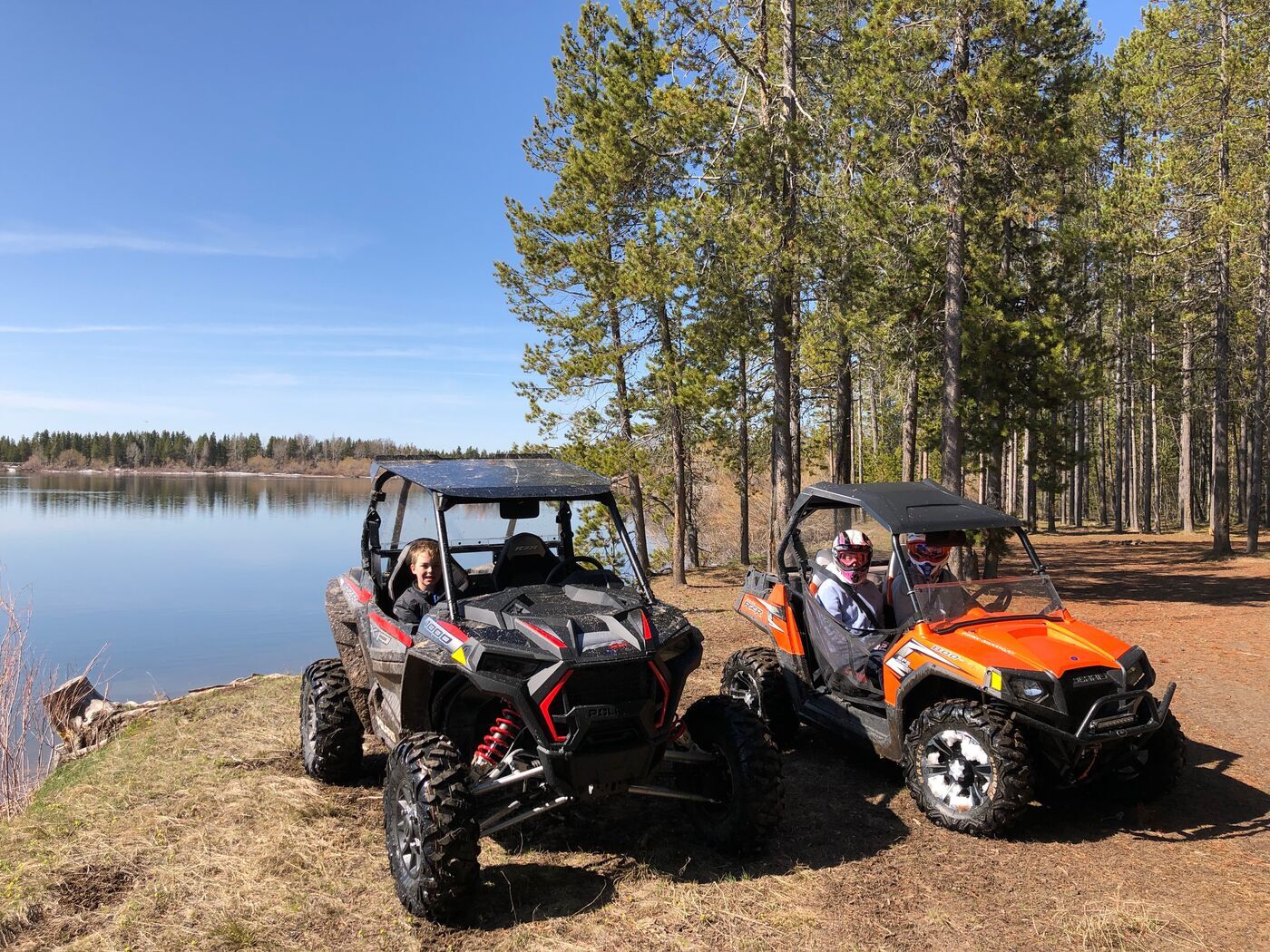Side-by-sides parked by a lake Two side-by-sides parked by a lake in Island Park, Idaho